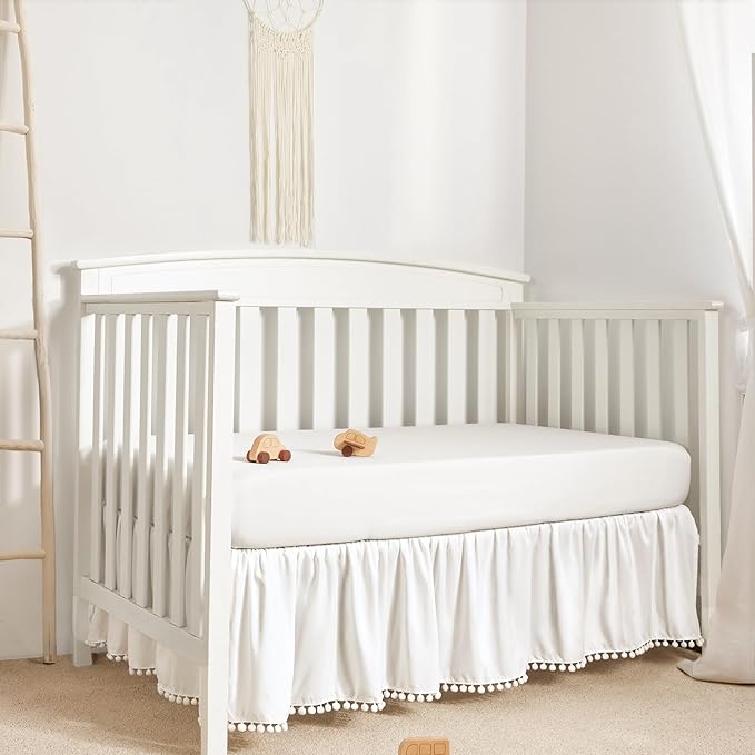 TILLYOU Baby Crib Skirt Girls Boys, Ruffled Bed Skirt with Pompoms, 28”x 52”, 14'' Drop, White